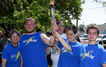 Storm Special Olympics Joins Law Enforcement for Torch Run in Larned